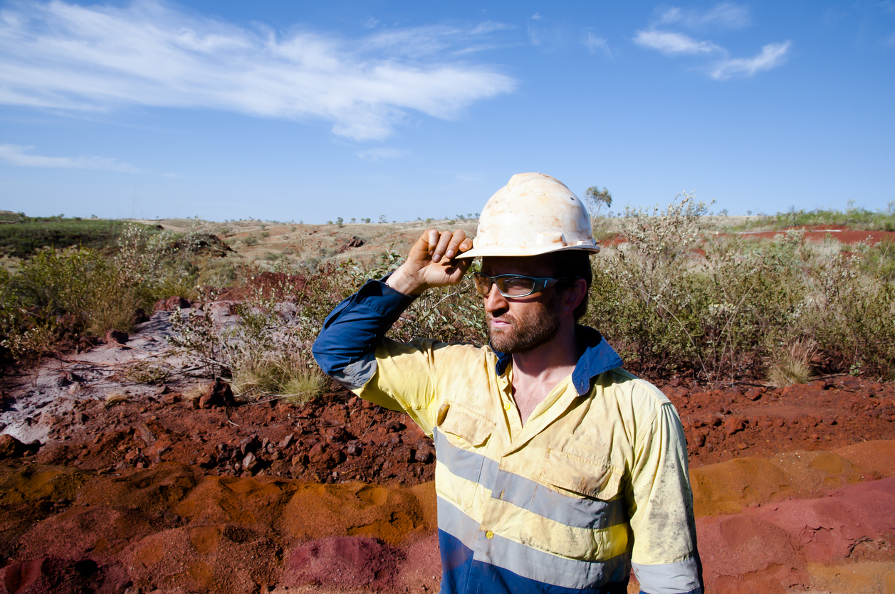 Miner Wearing Hardhat While Standing On Field Photo taken in Newman, Australia