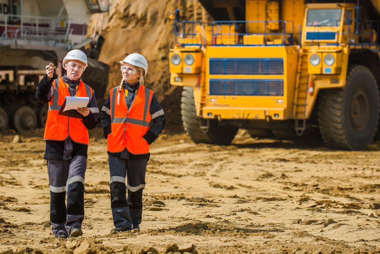 Man and woman working in an open-pit